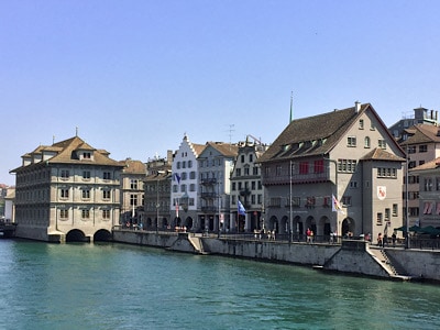 A view of the river in Zurich with the rathaus over the water