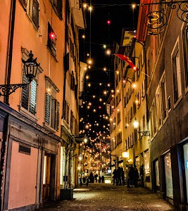 A street in the old town lit up at night in winter