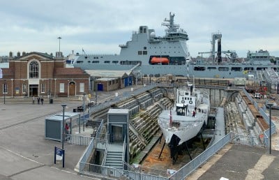 HMS M.33 (foreground ship) in dry dock