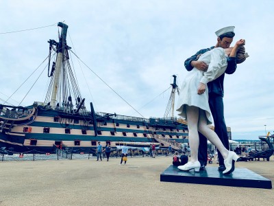 The Embracing Peace statue in front of HMS Victory - one of the Portsmouth attractions you can see in the dockyard