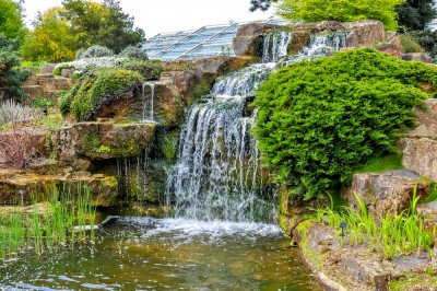 A rock garden at Kew with a waterfall