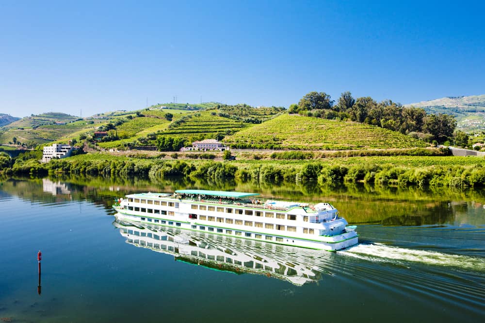 A cruise ship sailing along the Douro River