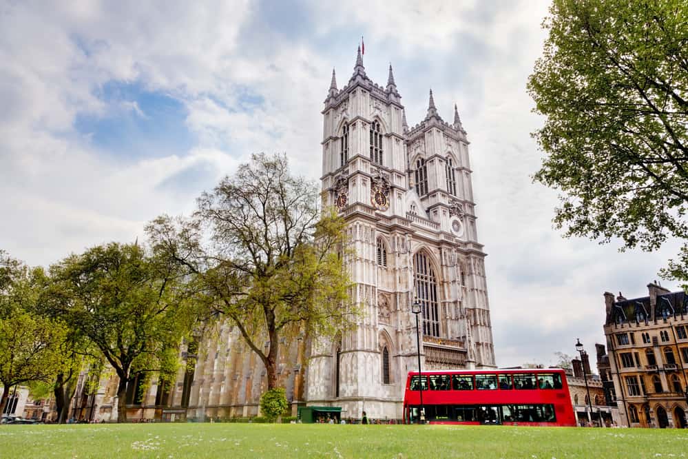 Westminster Abbey with a London bus riding past it