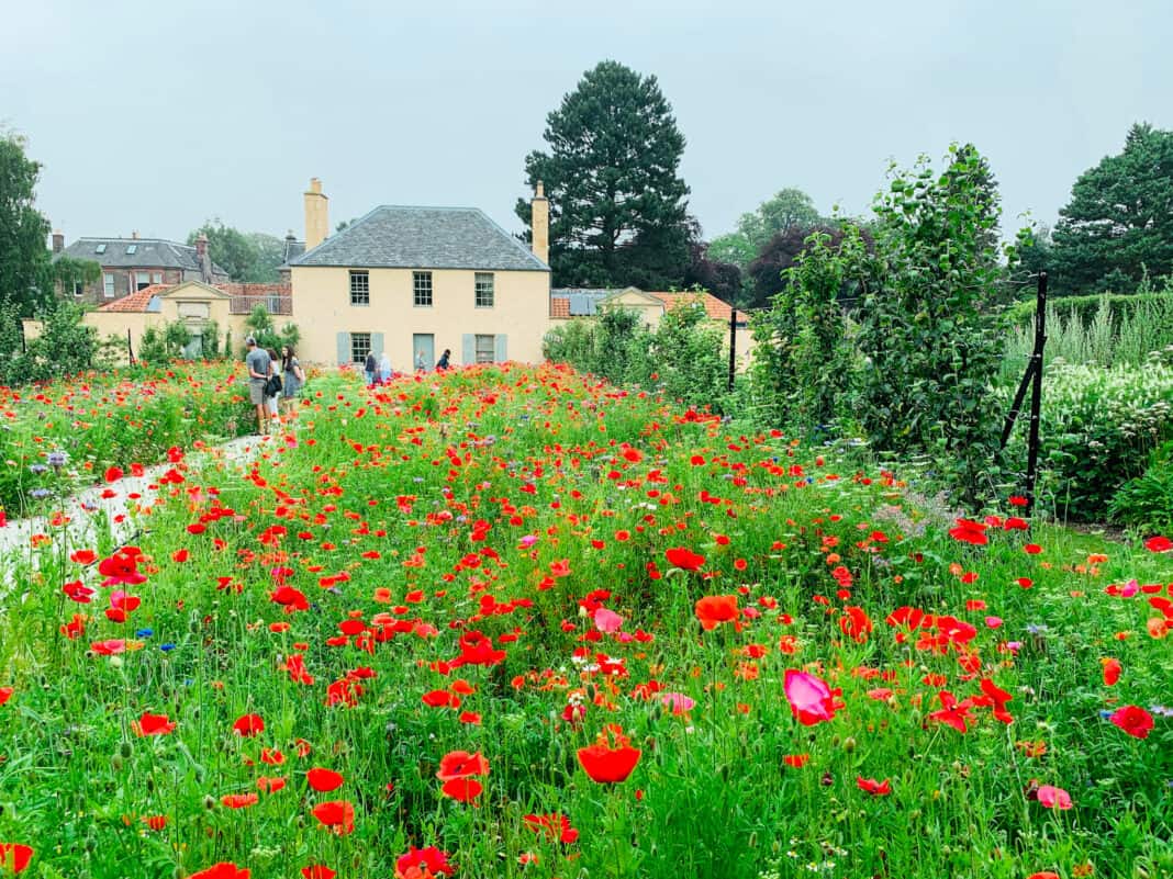 Part of one of the gardens at the Royal Botanic Garden in Edinburgh, with a small cottage at the back