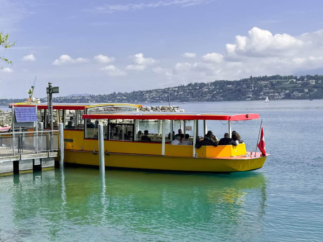 One of the small yellow boats that go across Lake Geneva in Geneva
