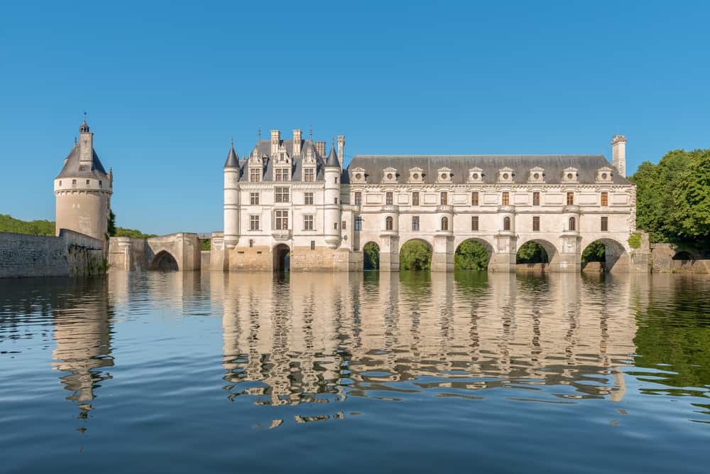 Chenonceau Castle spanning the Cher river in the Loire Valley and one of main chateaux to visit on a day trip from Paris to the Loire Valley