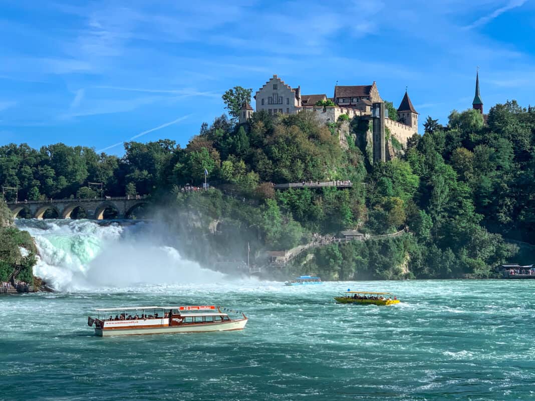 Boat trips on the Rhine Falls with Schloss Laufen in the background