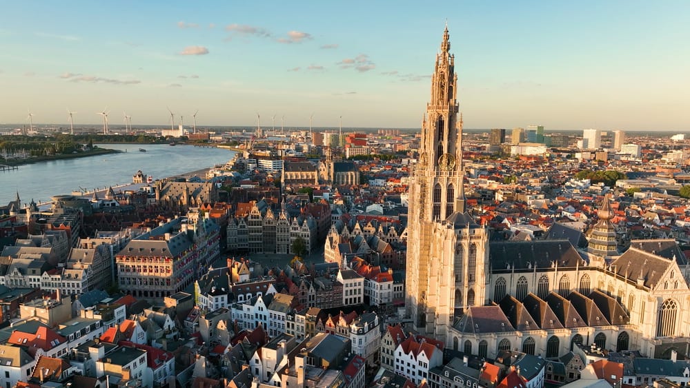 An aerial view of Antwerp city with the cathedral and river to the left