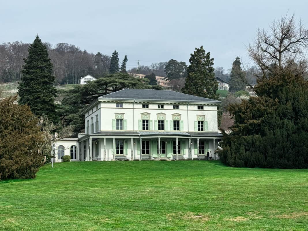 The Manoir de Ban with the large green lawn in front of it