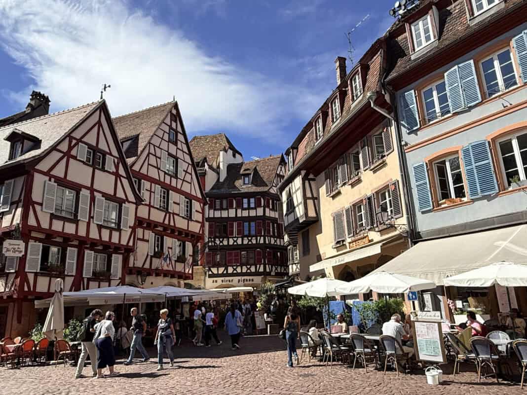 One of the small squares in Colmar with cafe bars and medieval buildings