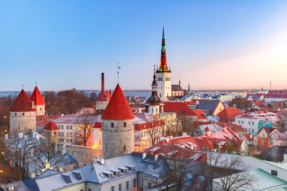 An image of the view over the rooftops in Tallinn with a church spire