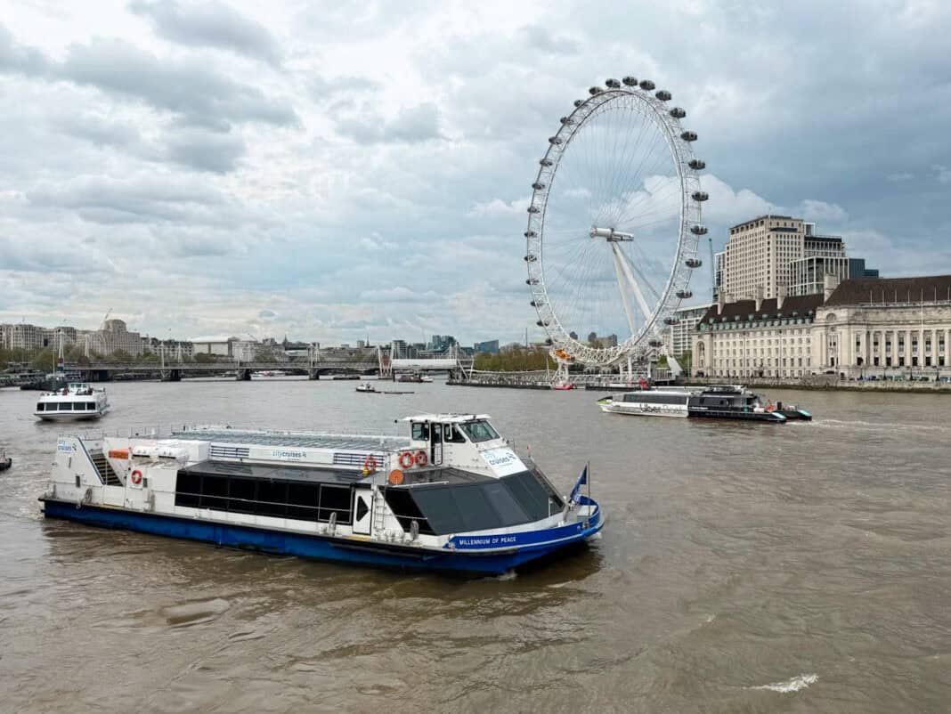 An image of a City Cruises boat and an Uber Boat near the London Eye