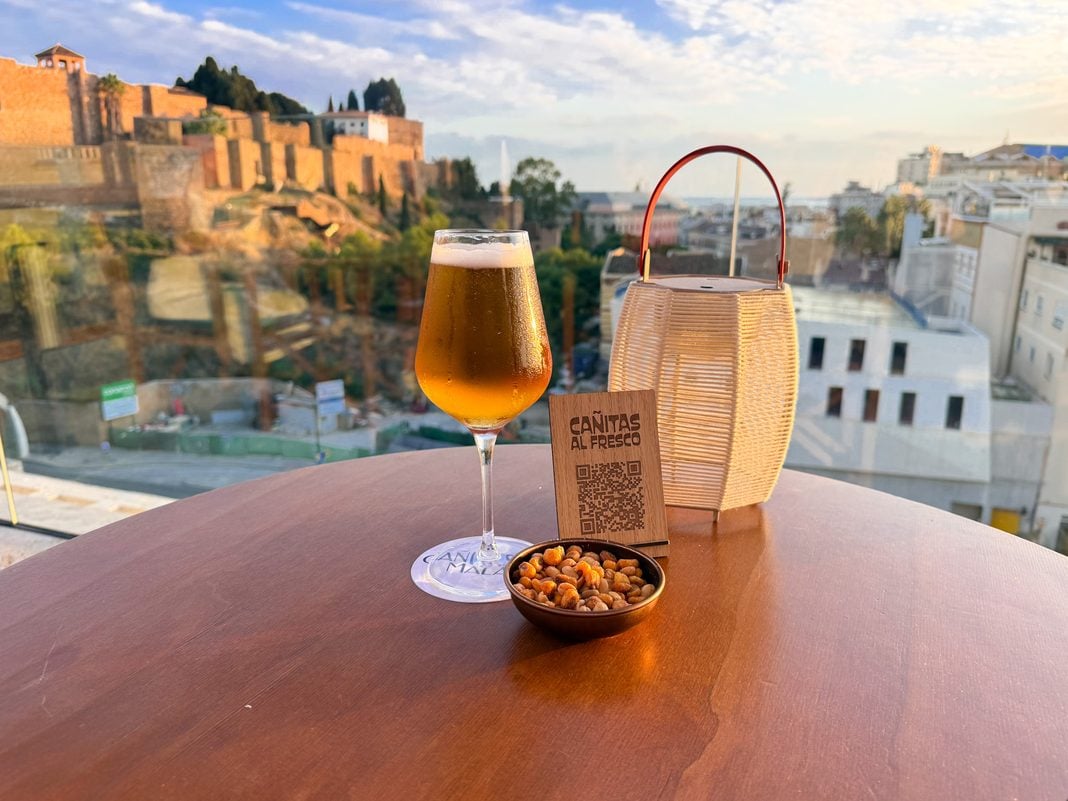 Beer and nuts on my hotel terrace with a view of the Alcazaba