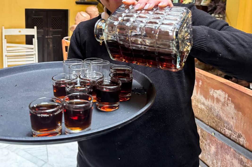 The orange wine being poured for us on our Seville food tour